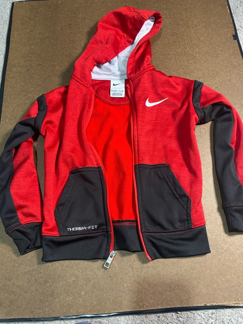 Nike Red and Black Therma-FIT Kids Zip Hoodie.